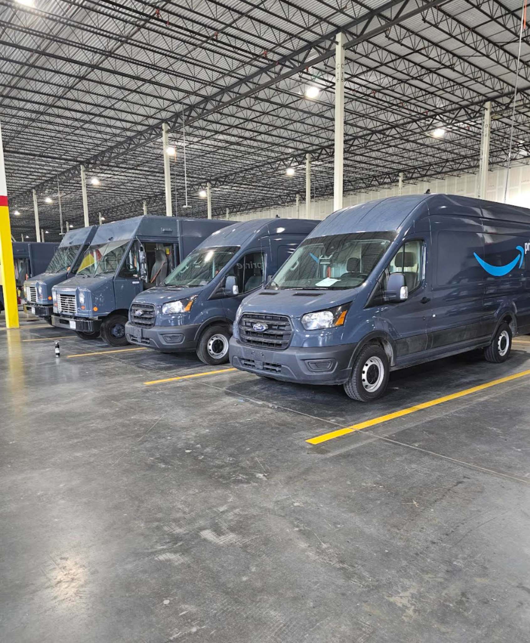 Amazon delivery vans at station